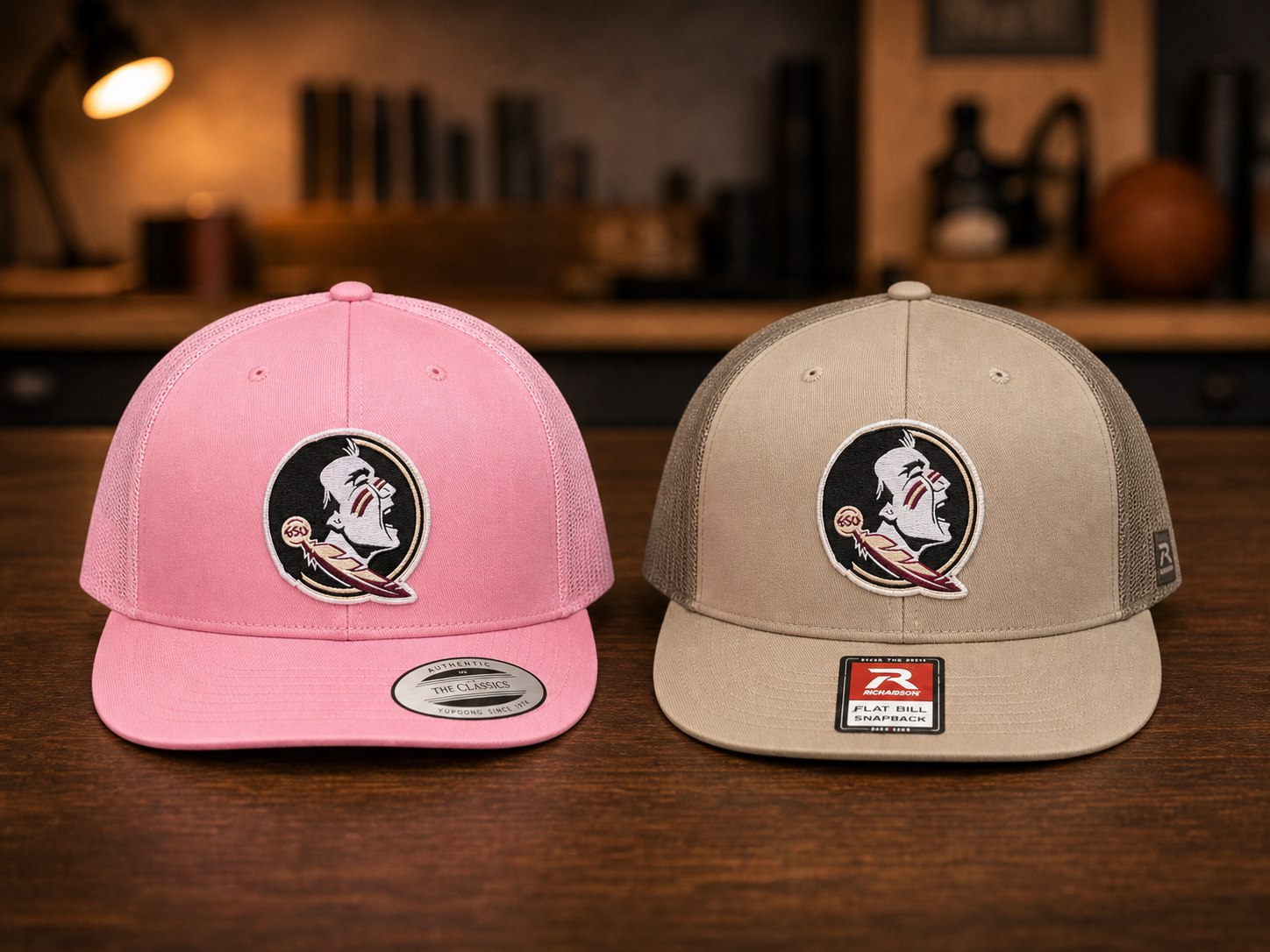 Pink and khaki team hats with matching front patches.