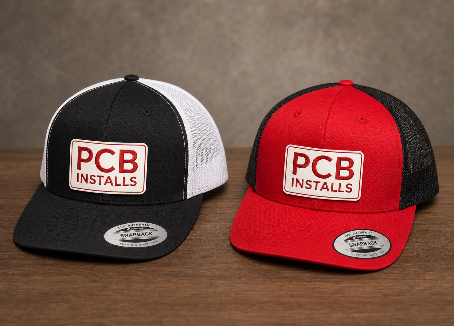 Black and red snapback hats with PCB Installs front patches.
